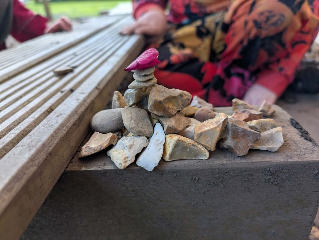 Pebble tower artwork created by children during Easter HAF 2026 at Wood‑Sage Outdoor Education