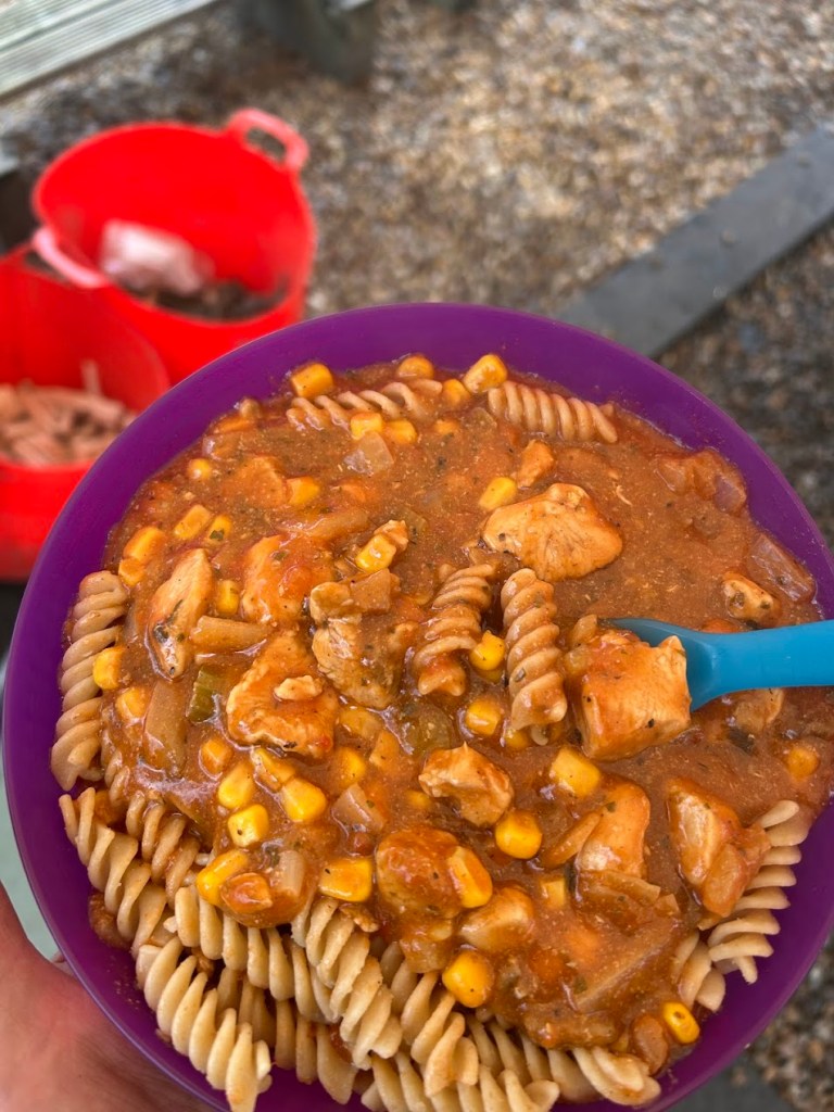 Bowl of chicken, pasta and sauce served during Easter HAF 2026 at Wood‑Sage Outdoor Education